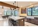 Spacious kitchen featuring a large island with seating, modern appliances, and a dining area at 795 Pine Brook Rd, Boulder, CO 80304