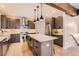 Well-equipped kitchen featuring a spacious island with seating, stainless steel appliances, and ample storage at 795 Pine Brook Rd, Boulder, CO 80304