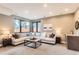 Spacious living room with a large window, comfortable seating, and modern lighting at 795 Pine Brook Rd, Boulder, CO 80304