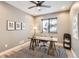 Home office features a rustic desk, striped rug, and natural light at 795 Pine Brook Rd, Boulder, CO 80304