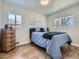 Bedroom with a comfortable bed, neutral color scheme, and natural light at 35 Everett St, Lakewood, CO 80226