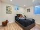 bedroom with a modern bed frame, striped blanket, and a colorful alphabet decoration at 35 Everett St, Lakewood, CO 80226