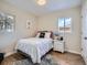 Bright bedroom with a large window and modern decor, creating a welcoming atmosphere at 35 Everett St, Lakewood, CO 80226