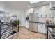 Well-lit modern kitchen featuring stainless steel appliances and sleek cabinetry at 35 Everett St, Lakewood, CO 80226