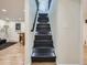 Elegant stairway with modern lighting, leading to upper-level spaces, blending style with functionality at 35 Everett St, Lakewood, CO 80226