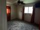 Carpeted bedroom with a ceiling fan, curtains, and some wall decor at 1985 Blackhawk St, Aurora, CO 80011