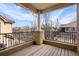 Balcony with wood flooring, black metal railings, and neighborhood views at 10127 Bluffmont Ln, Lone Tree, CO 80124