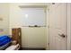 A versatile storage space with a blank whiteboard, a door, and some miscellaneous objects at 10127 Bluffmont Ln, Lone Tree, CO 80124