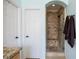 Bathroom shower featuring custom tile work, built in seat and shelves, and a glass shower door at 10127 Bluffmont Ln, Lone Tree, CO 80124