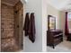 Modern walk-in shower with neutral tile, and brown towels, located next to bedroom dresser at 10127 Bluffmont Ln, Lone Tree, CO 80124