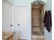 Modern bathroom with a glass-enclosed shower, neutral tile and convenient accessibility with brown towels at 10127 Bluffmont Ln, Lone Tree, CO 80124