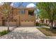 Beautiful exterior of a home featuring a two-car garage, driveway, and tasteful landscaping at 10127 Bluffmont Ln, Lone Tree, CO 80124