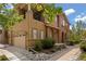 Attractive exterior elevation of a multi-story home with a two car garage and manicured landscaping at 10127 Bluffmont Ln, Lone Tree, CO 80124