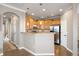 Cozy kitchen view featuring a breakfast bar, stainless steel appliances, and warm wood cabinets at 10127 Bluffmont Ln, Lone Tree, CO 80124