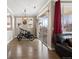 Bright living area leading to a balcony, showcasing hardwood floors and neutral tones at 10127 Bluffmont Ln, Lone Tree, CO 80124
