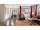 Spacious living area with hardwood floors, natural light, and comfortable seating at 10127 Bluffmont Ln, Lone Tree, CO 80124