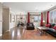 Open living space featuring hardwood floors, large windows, and ample natural light at 10127 Bluffmont Ln, Lone Tree, CO 80124