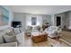 Bright living room featuring hardwood floors, large window with natural light, and comfortable seating arrangement at 3621 S Kalispell St, Aurora, CO 80013