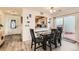 Cozy dining area with wood-look flooring, modern table set, and sliding glass door to the outside at 20000 Mitchell Pl # 51, Denver, CO 80249