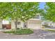 Charming two-story home featuring a brick driveway, a two-car garage and neutral toned siding at 20000 Mitchell Pl # 51, Denver, CO 80249