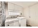 Functional laundry room with cabinetry and modern appliances, providing convenience and ample storage at 20000 Mitchell Pl # 51, Denver, CO 80249