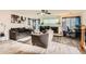 Bright living room features modern furnishings, hardwood-style floors, and a fireplace with decorative accents at 20000 Mitchell Pl # 51, Denver, CO 80249