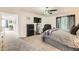 This is a main bedroom featuring a dresser and tv next to the bed along with a door to another room at 20000 Mitchell Pl # 51, Denver, CO 80249