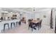 Bright and open kitchen and dining area with wood floors and stainless steel appliances at 3067 S Holly Pl, Denver, CO 80222