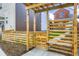 Private backyard area with wooden pergola, fencing, and landscaping at 6926 Kendrick Ln, Arvada, CO 80007