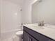 Modern bathroom featuring tile and a shower-tub combo with marble floors at 6926 Kendrick Ln, Arvada, CO 80007