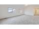 Spacious bedroom with neutral carpeting and natural light from large windows at 6926 Kendrick Ln, Arvada, CO 80007
