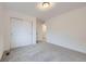 Cozy bedroom featuring carpet, a closet, and neutral decor at 6926 Kendrick Ln, Arvada, CO 80007