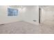 Well lit room features plush carpeting and a window at 6926 Kendrick Ln, Arvada, CO 80007