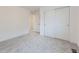 Bright bedroom features plush carpeting and a closet with sliding doors at 6926 Kendrick Ln, Arvada, CO 80007
