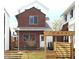 Brick home featuring a pergola, fenced yard, and white trim accents at 6926 Kendrick Ln, Arvada, CO 80007