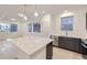Spacious kitchen with a central island, stainless steel appliances, and modern finishes at 6926 Kendrick Ln, Arvada, CO 80007