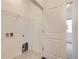 The laundry room includes hookups for a washer and dryer and shelving at 6926 Kendrick Ln, Arvada, CO 80007