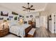 Cozy bedroom with natural light, tray ceilings, and decorative wall art at 7360 S Owens Ct, Littleton, CO 80127