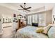 Bright main bedroom with trey ceilings, plantation shutters, and en suite bathroom access at 7360 S Owens Ct, Littleton, CO 80127