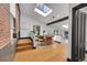 Dining room with skylights, hardwood flooring, and exposed brick wall at 54 S Emerson St # 4, Denver, CO 80209