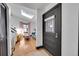 Bright entryway with a skylight and a view into the living room, showcasing the home's modern design at 54 S Emerson St # 4, Denver, CO 80209