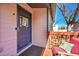 Cozy front porch featuring a seating area and a charming, painted door at 54 S Emerson St # 4, Denver, CO 80209