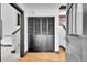 Bright hallway with hardwood floors and black accents near the staircase and closet at 54 S Emerson St # 4, Denver, CO 80209