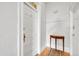 Welcoming hallway featuring hardwood floors, a stylish wooden accent table, and neutral paint at 54 S Emerson St # 4, Denver, CO 80209