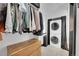 Efficient laundry area with wooden dresser, closet space, and stacked washer-dryer units at 54 S Emerson St # 4, Denver, CO 80209