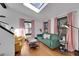 Sunlit living room with hardwood floors, a skylight, and colorful furniture creating a cozy atmosphere at 54 S Emerson St # 4, Denver, CO 80209