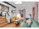 Stylish living room with a skylight, exposed brick accents, and modern furnishings at 54 S Emerson St # 4, Denver, CO 80209