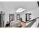 Bright living room with a skylight, hardwood floors, and neutral furnishings at 54 S Emerson St # 4, Denver, CO 80209