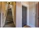 Interior stairwell with carpeted steps and neutral decor leading to upper levels at 54 S Emerson St # 4, Denver, CO 80209