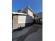 A modern townhome with a combination of stone and siding, and a well-maintained exterior at 14883 E Crestridge Dr, Centennial, CO 80015